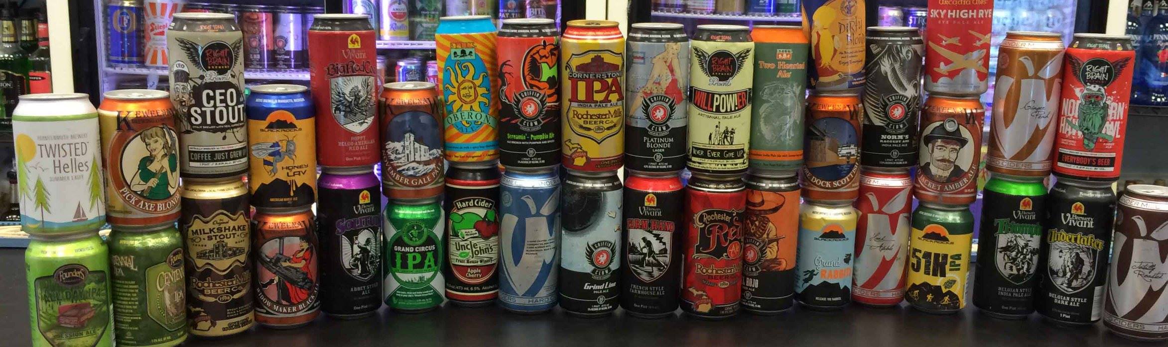 The Tin Can selection — 36+ craft cans lined up across the bar: Twisted Helle, CEO Stout, IPAs, sours, and more.